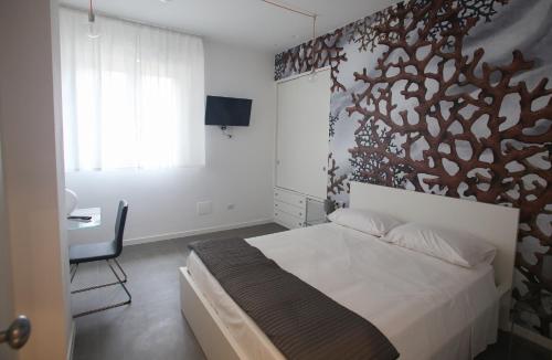 Ένα ή περισσότερα κρεβάτια σε δωμάτιο στο Caicco suite
