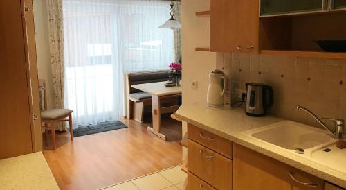 a kitchen with a sink and a counter top at Appartement Luca in Schladming