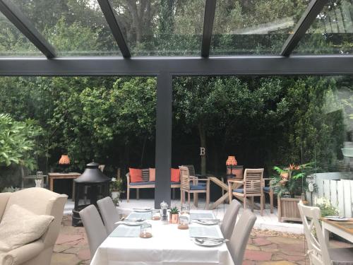 a patio with a white table and chairs at JustB Edinburgh in Edinburgh