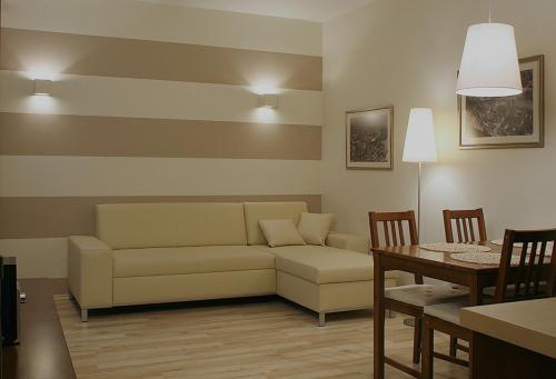 a living room with a couch and a table at Apartamenty Junior in Wrocław