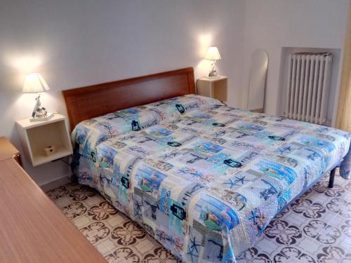 מיטה או מיטות בחדר ב-Appartamento Alba Rosa