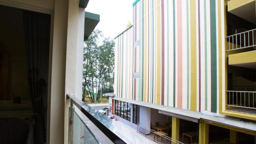 a view from the hallway of a building at Anda Beachside Hotel in Karon Beach