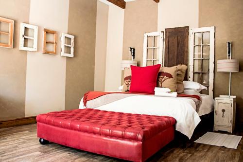 Ένα ή περισσότερα κρεβάτια σε δωμάτιο στο Cape Karoo Guesthouse