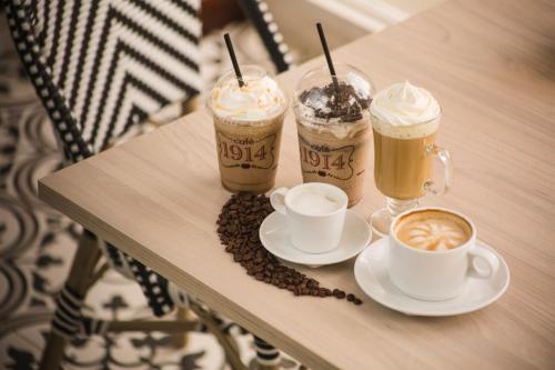 a table with three cups of coffee on it at Radisson Hotel Panama Canal in Panama City