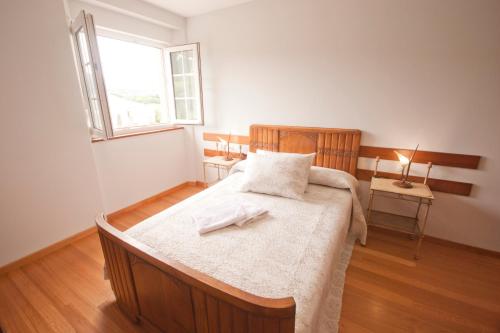 Postel nebo postele na pokoji v ubytování As Viñas