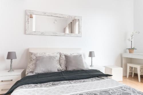 Postel nebo postele na pokoji v ubytování Apartamenty Trzy Wieze
