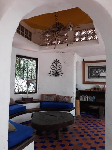 a living room with blue couches and a table at Casa Constantino in Rivera