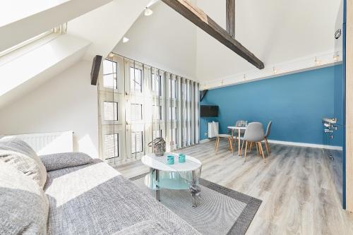 a living room with a couch and a table at Apartments am Markt in Bernkastel-Kues