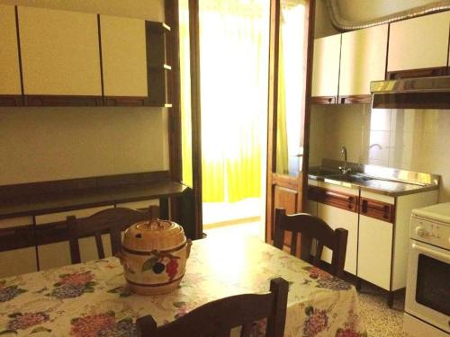 a kitchen with a table with a pot on it at Via Roma 44 in Follonica
