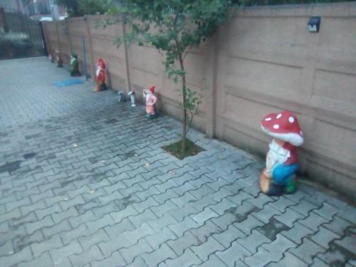 a group of toy figurines standing next to a tree at Casa Ovi și Simo in Haţeg