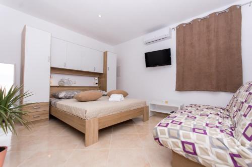 Postel nebo postele na pokoji v ubytování Apartment Sandra