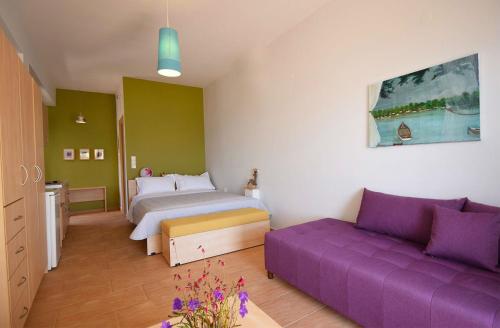 Postel nebo postele na pokoji v ubytování Elina Apartments