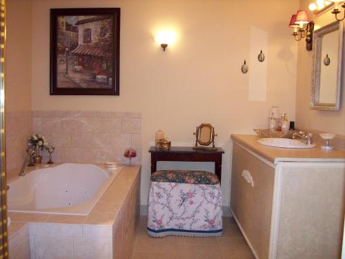 a bathroom with a tub and a sink at Oceanhillside B&B in Digby