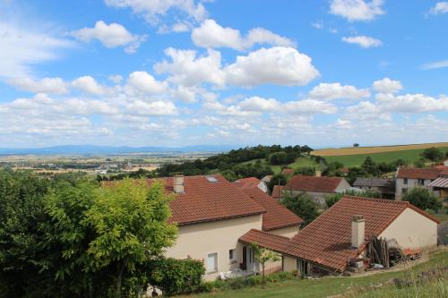 a view of a village with houses at "LES MONNATS" GITE 8 personnes à la campagne in Chaptuzat