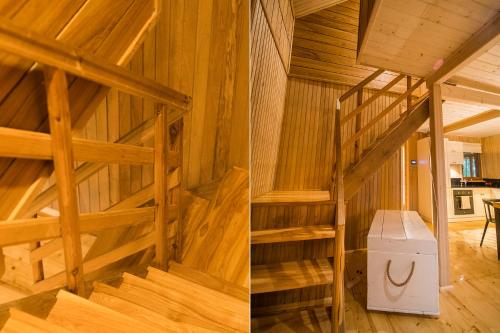 a room with wooden stairs in a house at Dwa Pomosty in Augustów