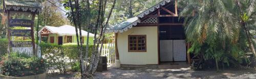 a small house with a door in a forest at Ciudad Perdida EcoLodge in Cahuita