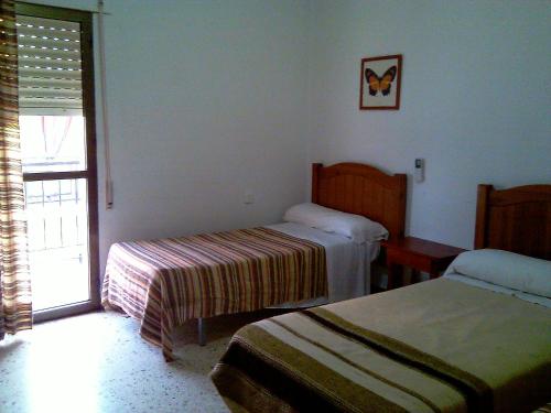 Tempat tidur dalam kamar di Pensión Ignacio