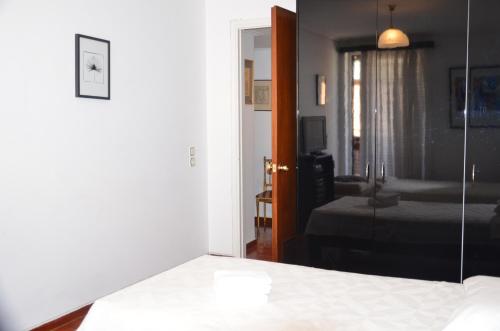 Ένα ή περισσότερα κρεβάτια σε δωμάτιο στο Perfect BeachFront Apartment