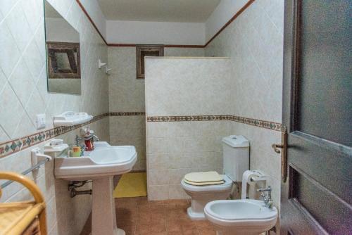 a bathroom with a sink and a toilet at B&B Le Balate in Augusta