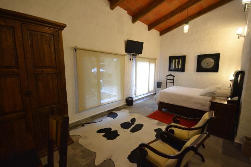 Rústika SPA Hotel Boutique 객실 침대