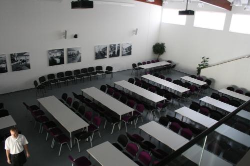 an overhead view of a room with tables and chairs at K-Triumf Resort in Velichovky