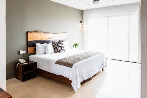 מיטה או מיטות בחדר ב-Hotel 52 Playa del Carmen