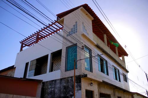 a house that is being built on a street at Florcamará POUSADA in Camaragibe