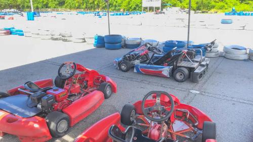 a group of four toy cars parked on the street at Hotel Sunset ZANPA in Yomitan