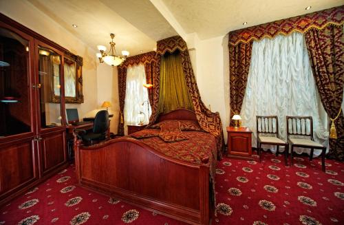 a bedroom with a bed with a canopy at Boutique Hotel Monte Kristo in Rīga