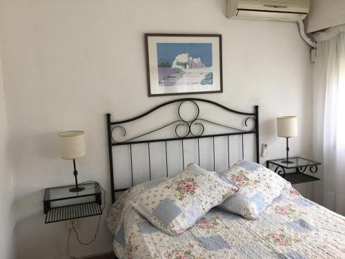 Ένα ή περισσότερα κρεβάτια σε δωμάτιο στο Complejo Arcobaleno