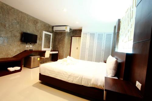 Intara Resort tesisinde bir odada yatak veya yataklar