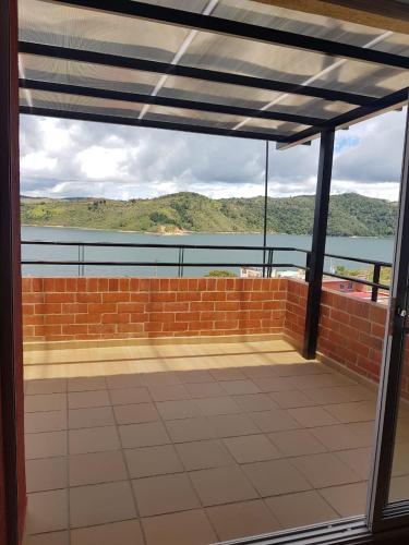 a view from the balcony of a house with a brick wall at Calima Darien in Calima