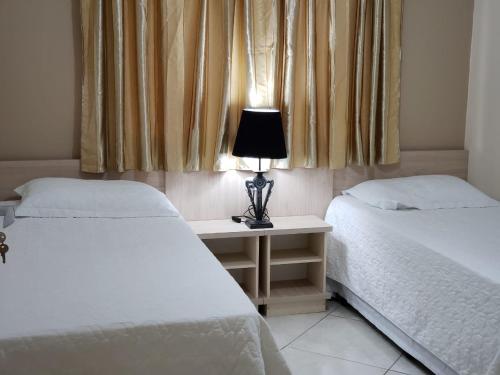 Łóżko lub łóżka w pokoju w obiekcie Felipe Family Houses - Casas de temporada