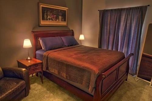 a bedroom with a large bed and a couch at The Barn, Lake Lodge in Mullingar