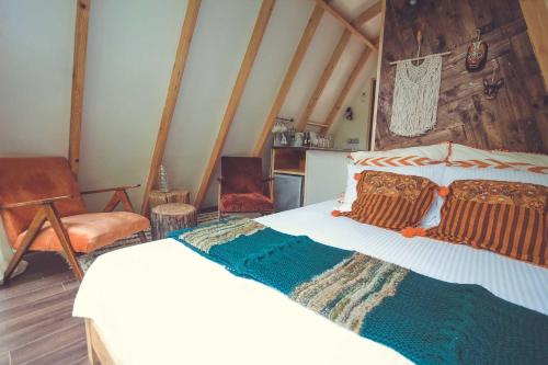 Ein Bett oder Betten in einem Zimmer der Unterkunft Duende Hotel