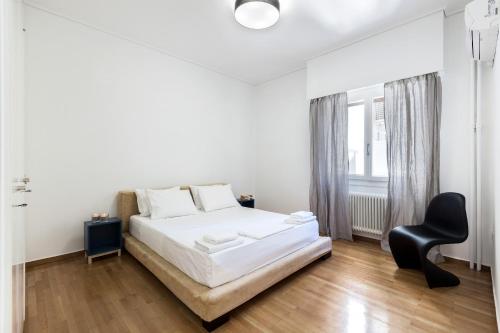 Postel nebo postele na pokoji v ubytování Likavittos Apartments