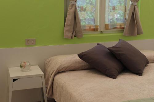 Un pat sau paturi într-o cameră la Camping Aquileia