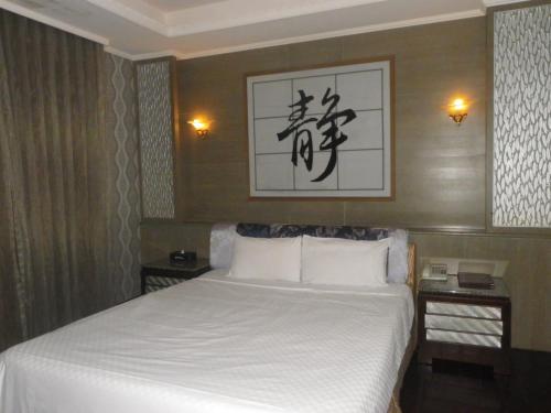 Ein Bett oder Betten in einem Zimmer der Unterkunft Sunflower Motel