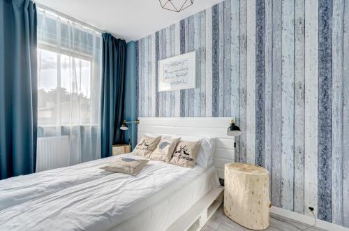 Posteľ alebo postele v izbe v ubytovaní Prime Apartments - Skandynawski