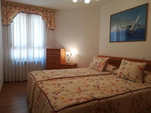 Postel nebo postele na pokoji v ubytování APARTAMENTO "PASEO DEL SAÚCO"