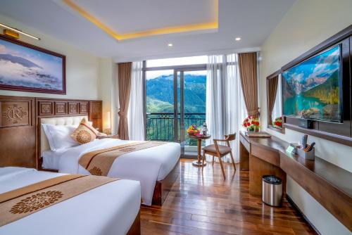 Postel nebo postele na pokoji v ubytování Sapa Relax Hotel & Spa