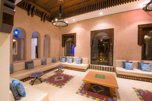 a large living room with couches and a table at Iberostar Waves Founty Beach All Inclusive in Agadir