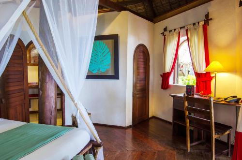 Ένα ή περισσότερα κρεβάτια σε δωμάτιο στο Princesse Bora Lodge & Spa