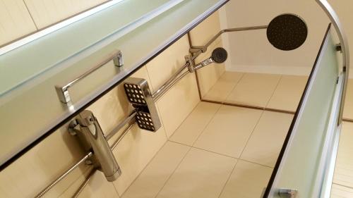 a staircase in a bathroom with a tile floor at Apartment Dora in Rijeka