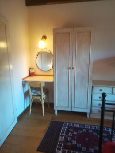 a room with a table with a mirror and a cabinet at Chalet Catton Two Bedroom Appartement near Bad Kleinkirchheim in Radenthein