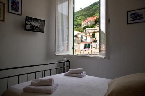 Postel nebo postele na pokoji v ubytování Guesthouse Rollando