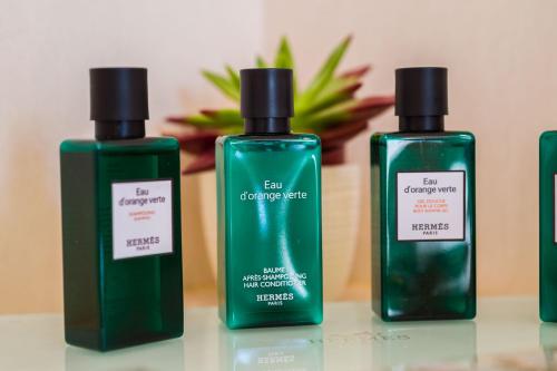 a group of three bottles of soap on a table at Borgo La Chiaracia Resort & SPA in Castel Giorgio