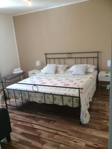 Кровать или кровати в номере Apartman Vitis