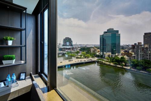 a view of a river from a window at Harbour 10 Hotel in Kaohsiung