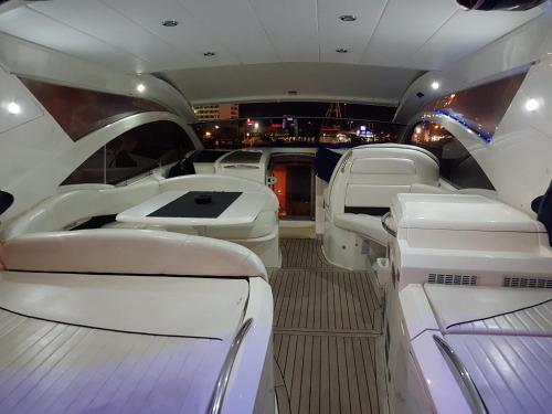 a view of the inside of a limousine with white seats at Red Sea Yachts in Eilat